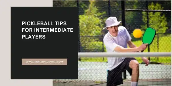 An image featuring a man in a white hat playing pickleball, positioned to hit a yellow ball with a green paddle on an outdoor court. On the left side, there's a black rectangular overlay with text that reads "PICKLEBALL TIPS FOR INTERMEDIATE PLAYERS" and the website address "WWW.PICKLEBALLRADAR.COM" in white lettering.